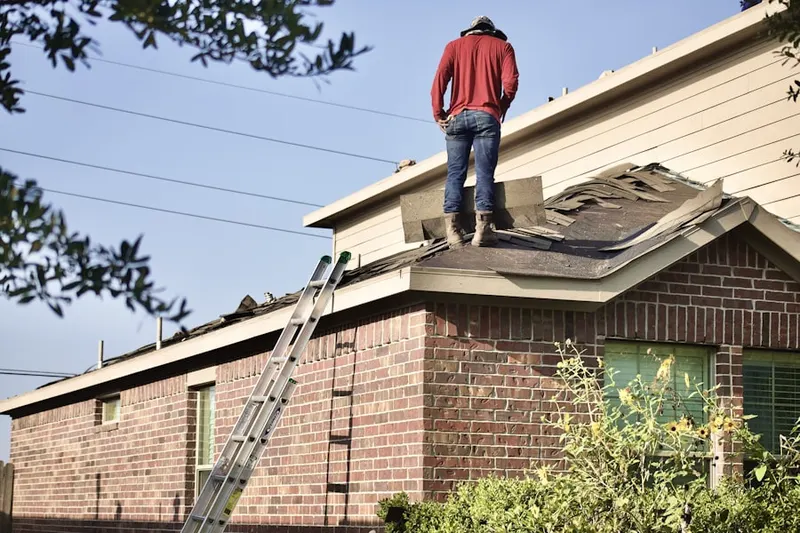 Professional roofer working on a residential roof in Montalvo